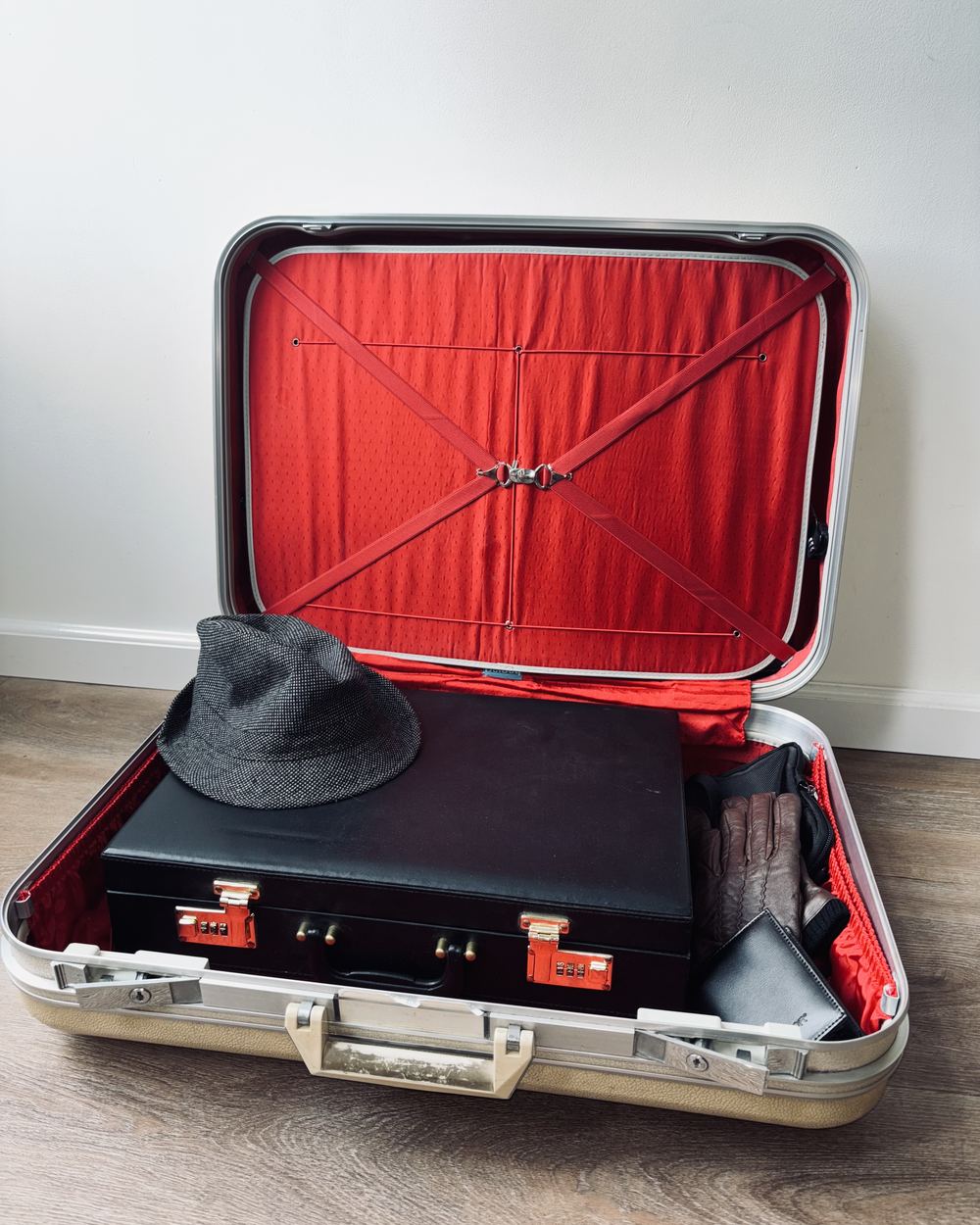 The real Agent 47-B case, open, with a briefcase, hat, gloves and wallet